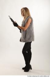 NIKOL STANDING POSE WITH SHOTGUN